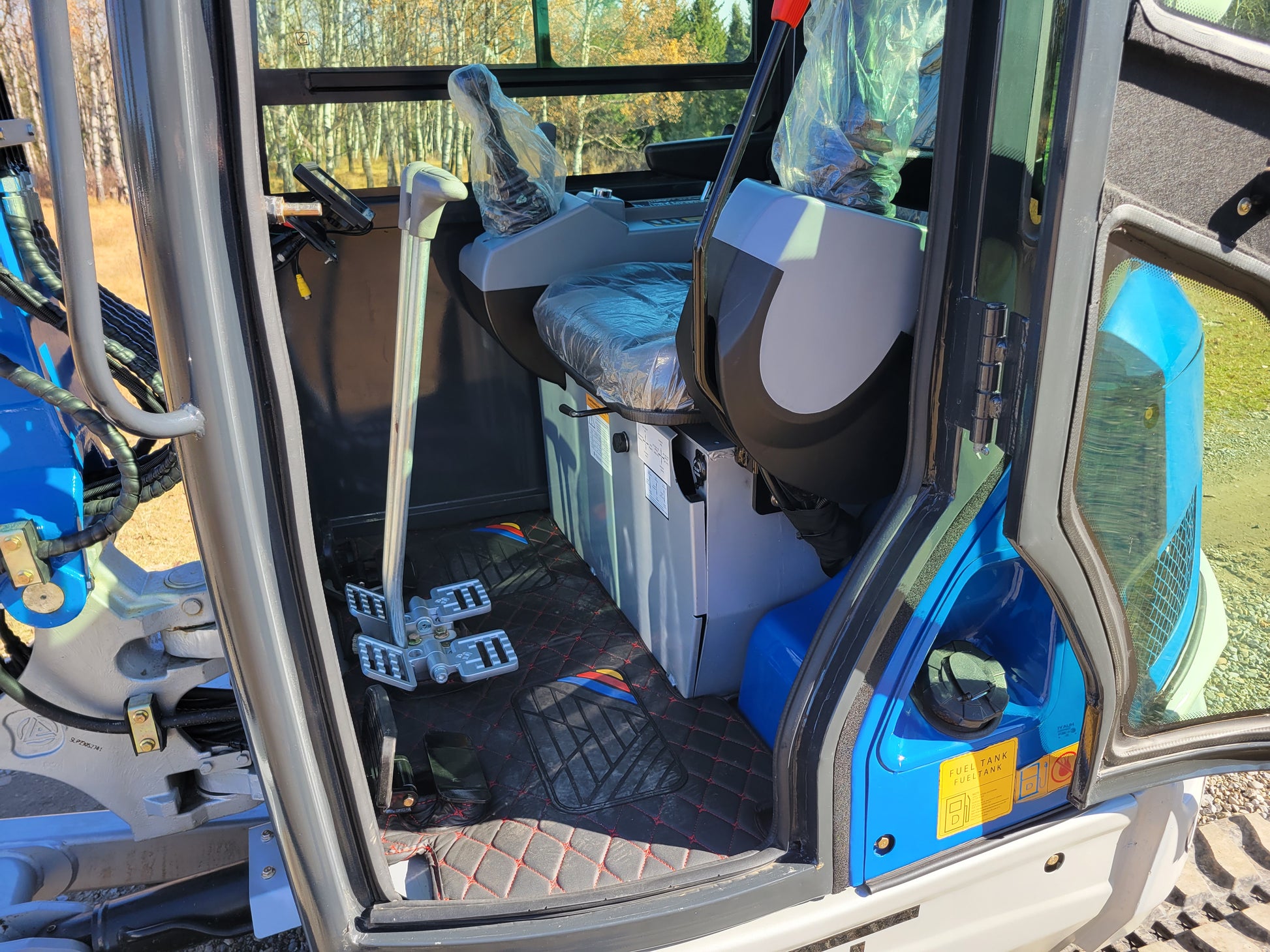 JT5350 3.5 ton mini excavator with Kubota engine showing interior view of operator cabin with seat controls and pedals designed for comfort and efficiency in Canada