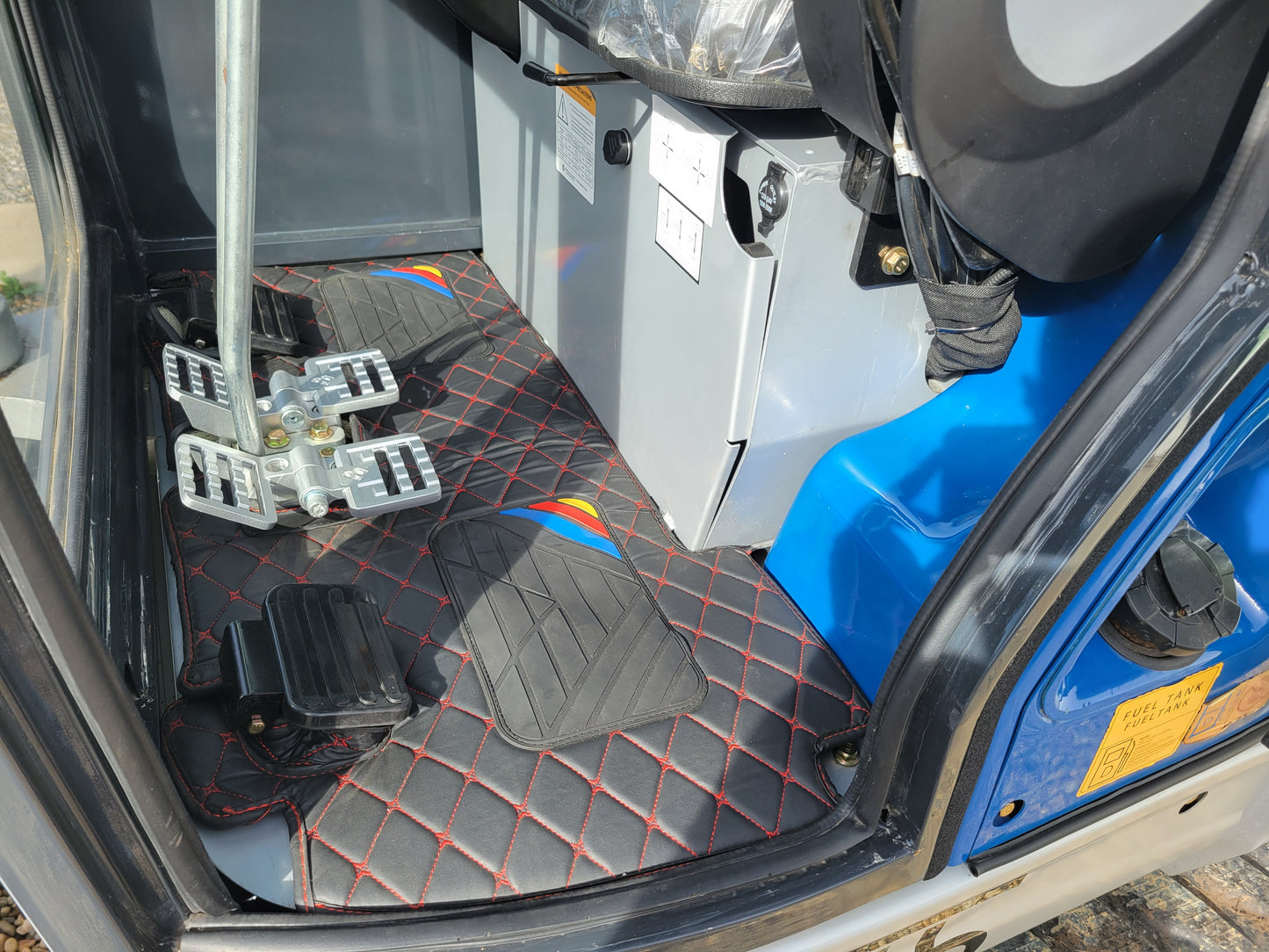 JT5350 3.5 ton mini excavator with Kubota engine interior closeup showing operator control pedals and floor layout built for comfort and precise handling in Canada