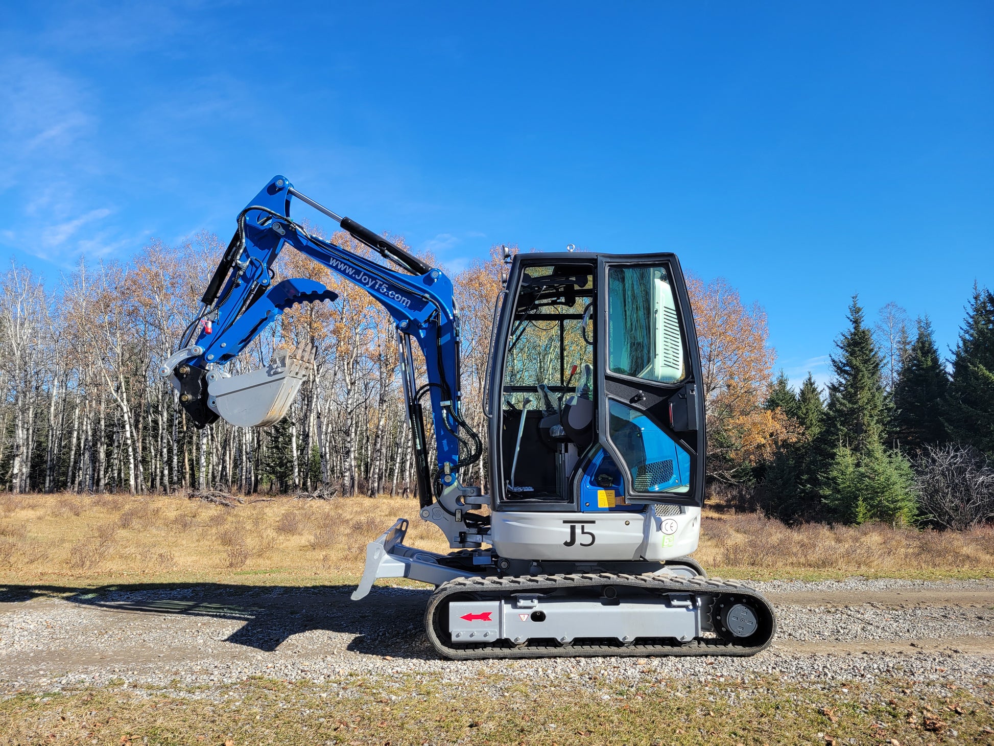 JT5350 3.5 ton mini excavator with Kubota engine small construction excavator featuring enclosed cab AC and hydraulic bucket working outdoors in Canada