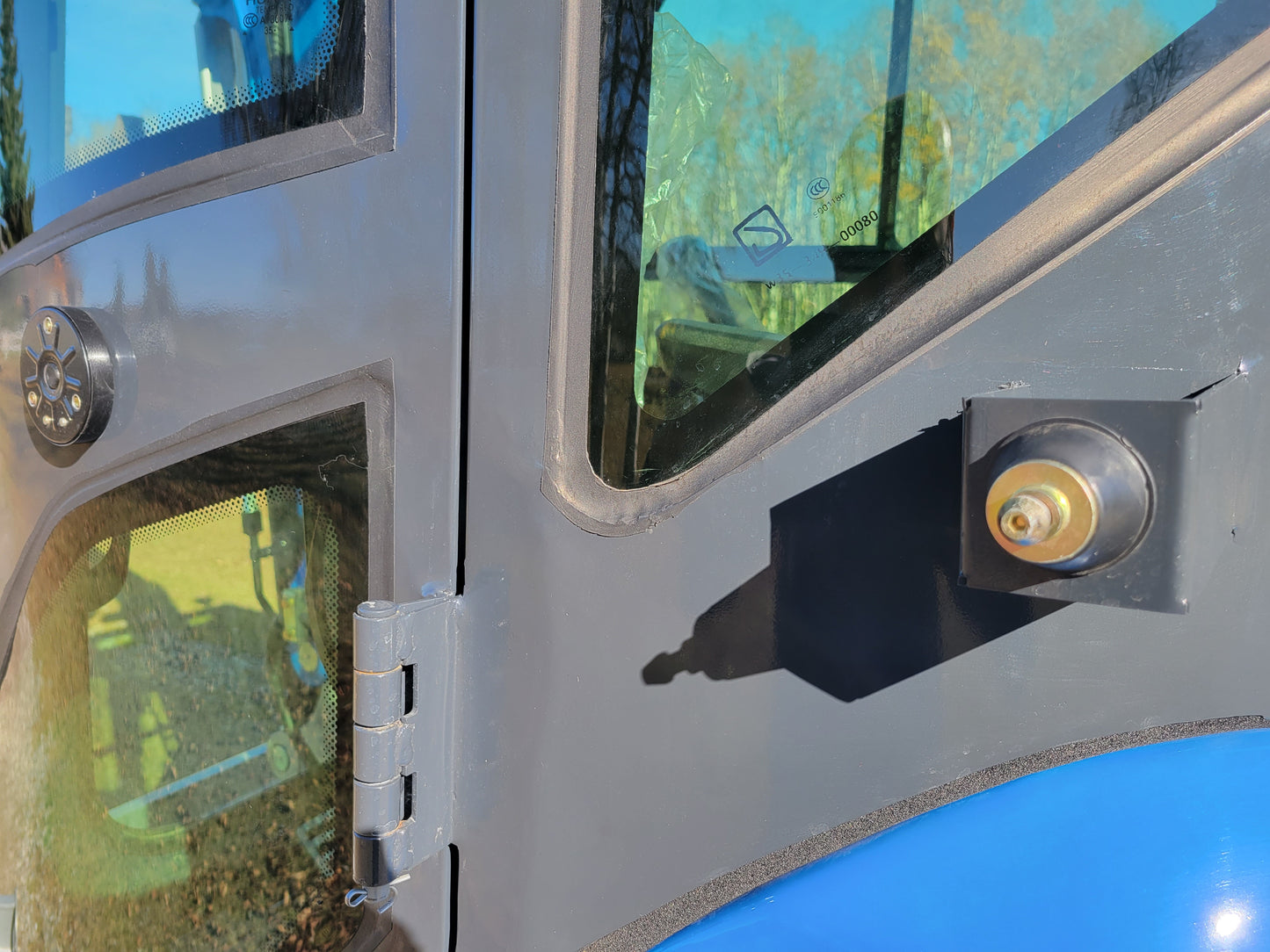 Close-up view of JT5350 Mini Excavator cabin door hinge and window – JoyT5 construction equipment