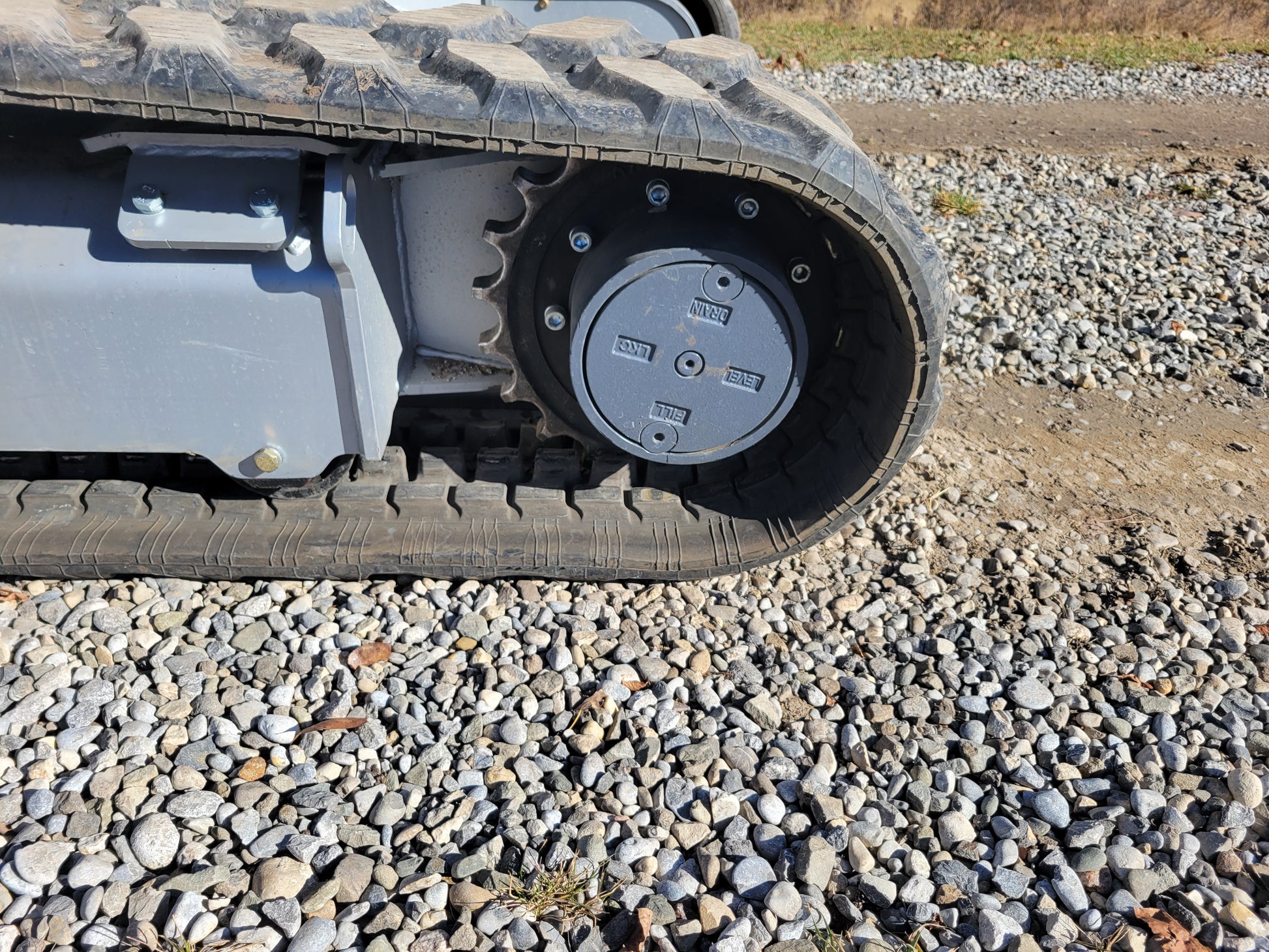 Close-up view of JT5350 Mini Excavator drive sprocket and rubber track system – JoyT5 equipment