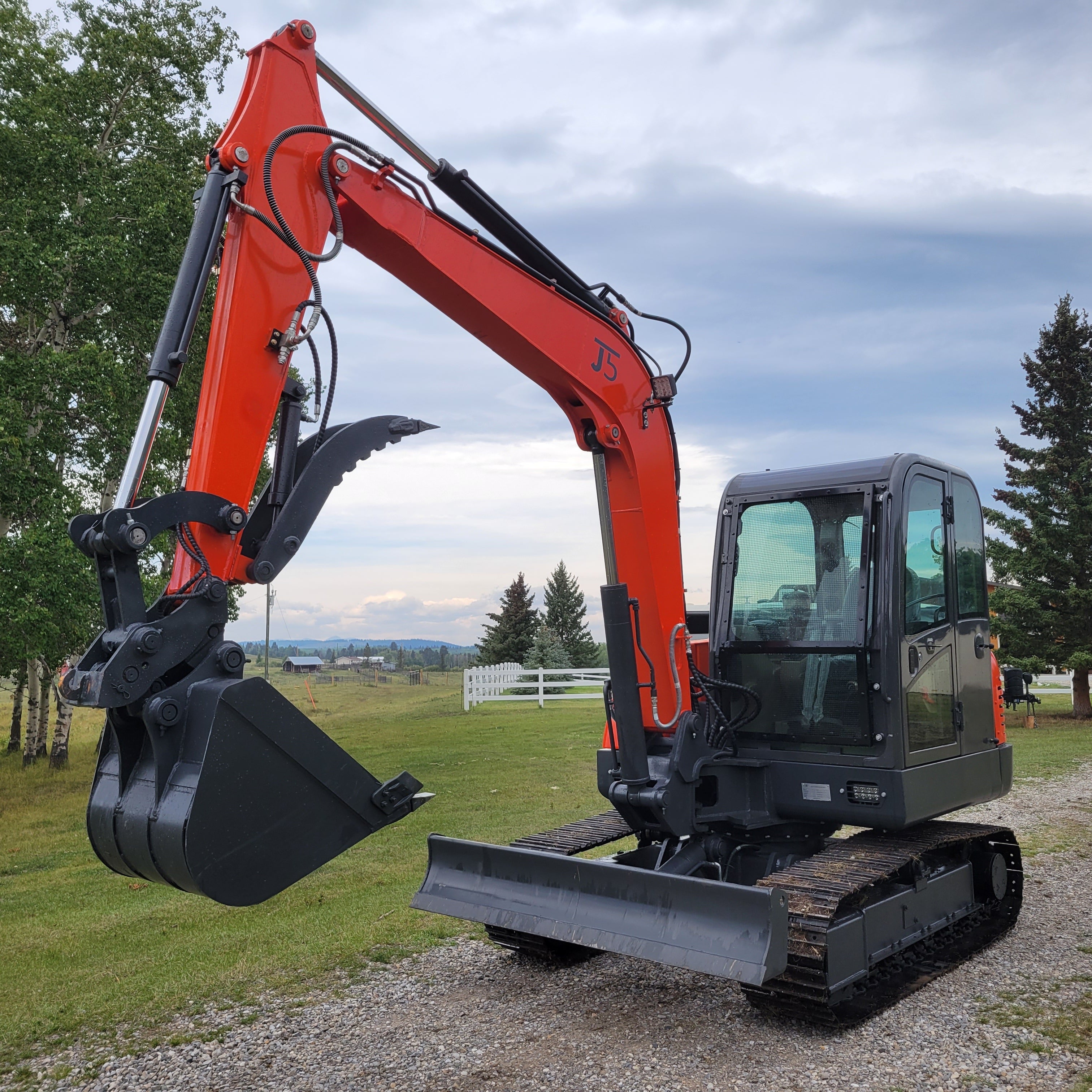 JT5600 6 ton mini excavator for sale in Canada powered by Yanmar engine compact construction equipment working on gravel path durable small excavator for landscaping and site development projects