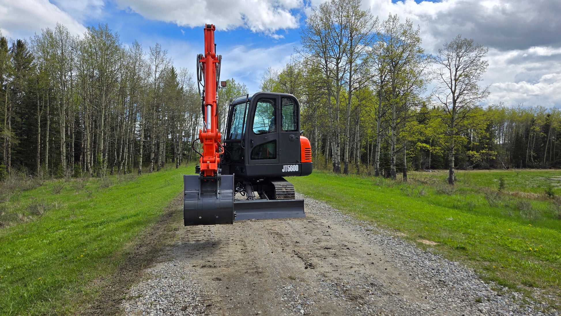 JT5600 6 ton mini excavator for sale in Canada with Yanmar engine compact construction equipment standing on gravel road durable small excavator for landscaping and heavy construction projects