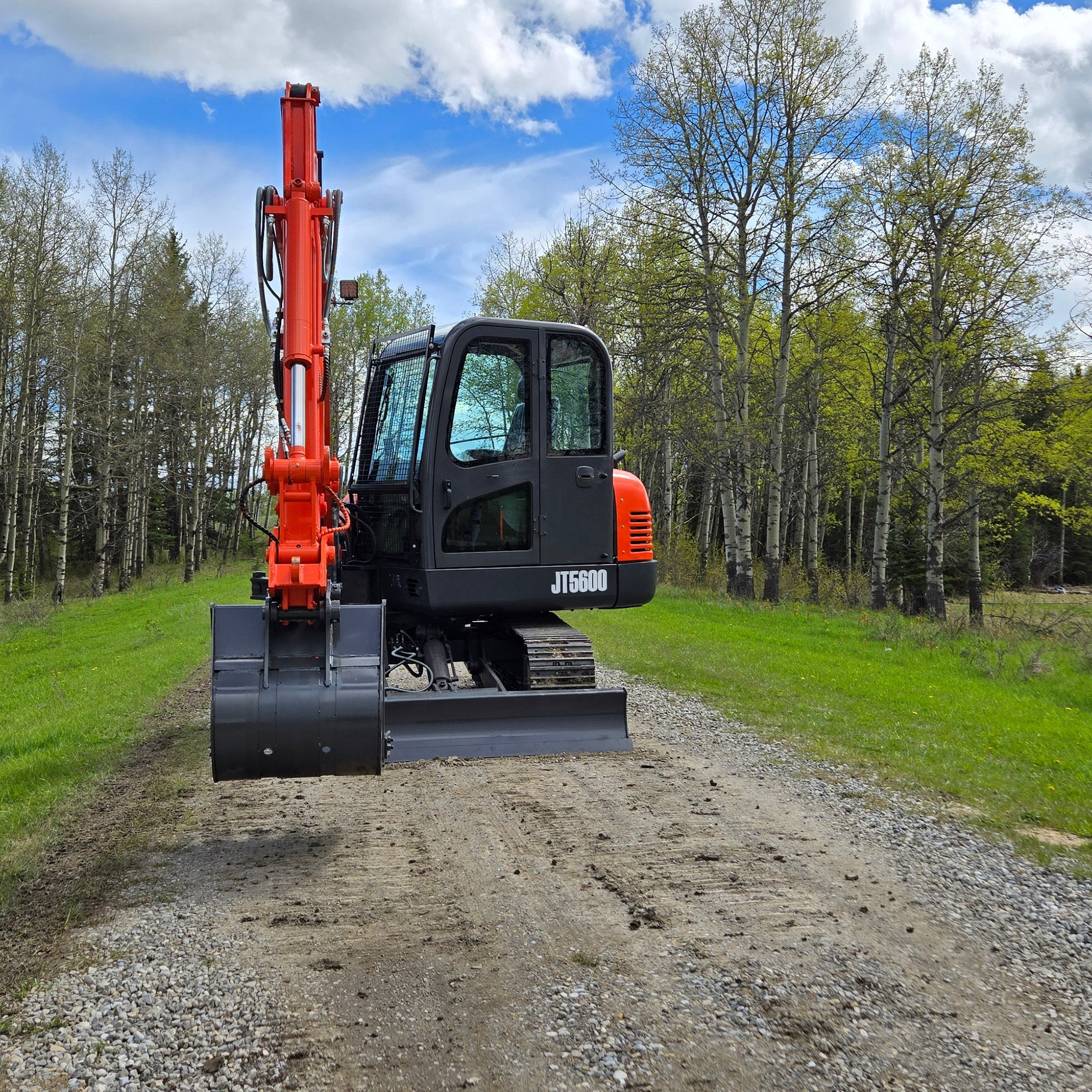 JT5600 6 ton mini excavator for sale in Canada with Yanmar engine compact construction equipment standing on gravel road durable small excavator for landscaping and heavy construction projects