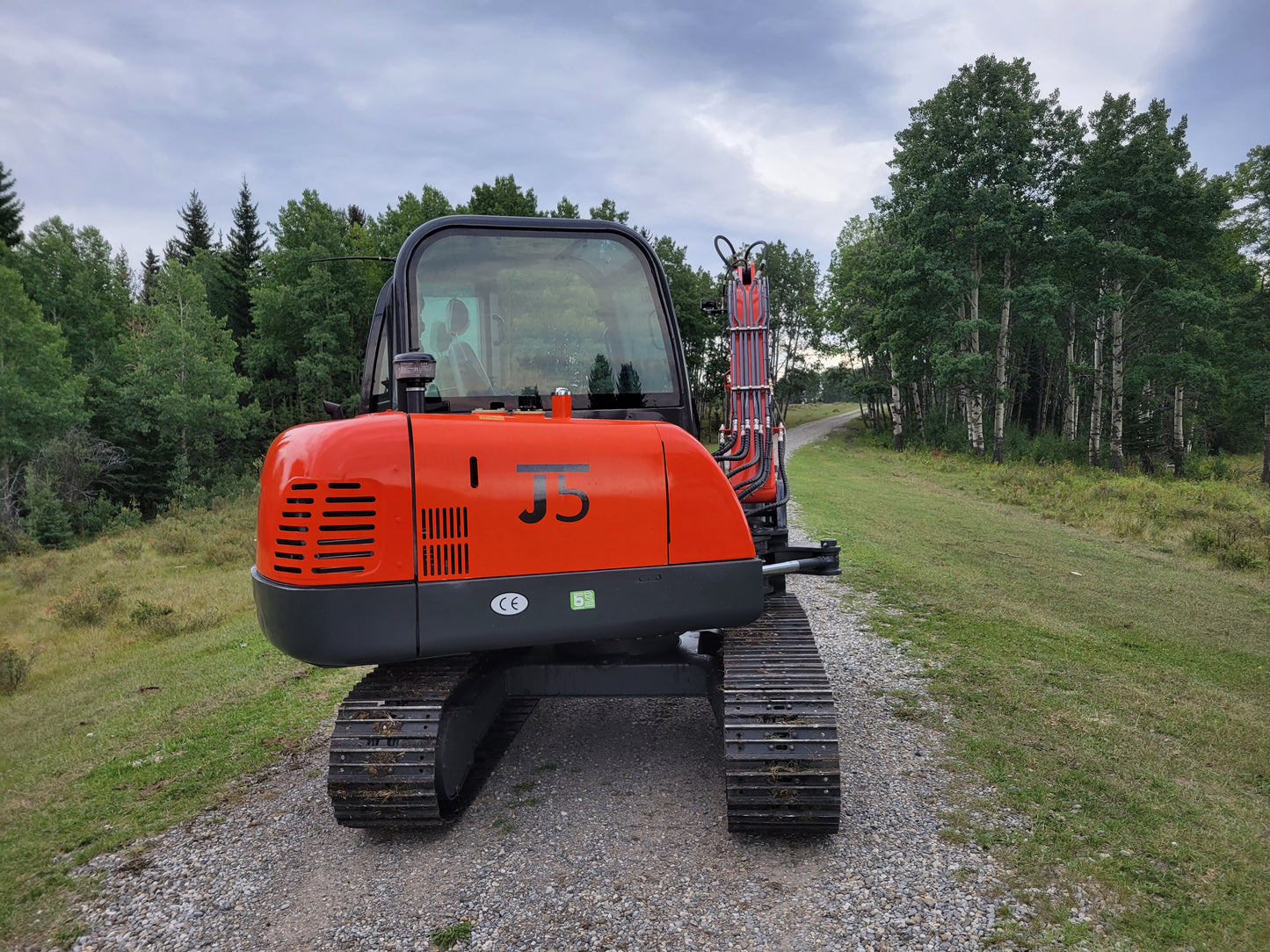 JT5600 6 ton mini excavator for sale in Canada powered by Yanmar engine rear view compact construction equipment durable small excavator standing on field for landscaping and projects

