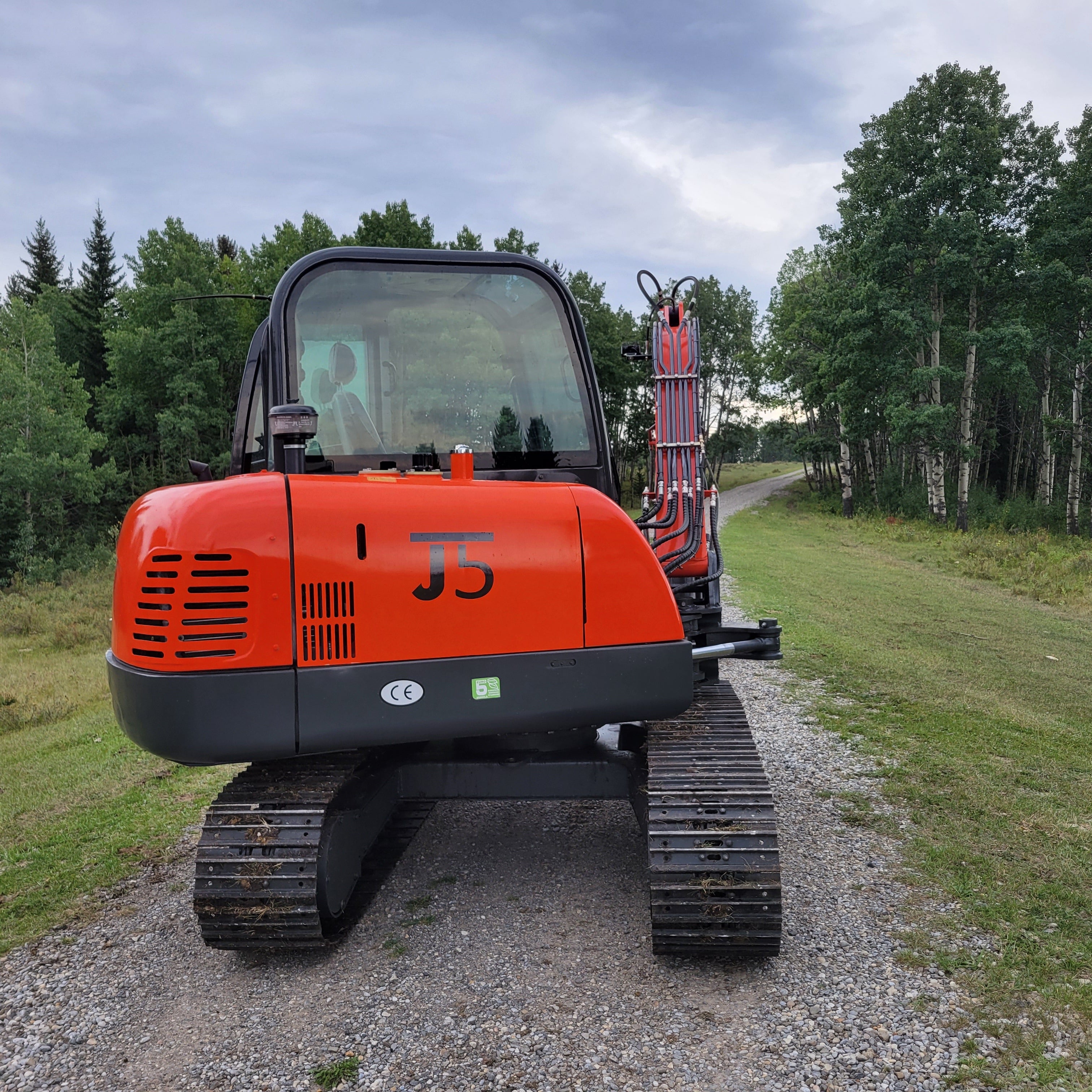 JT5600 6 ton mini excavator for sale in Canada powered by Yanmar engine rear view compact construction equipment durable small excavator standing on field for landscaping and projects