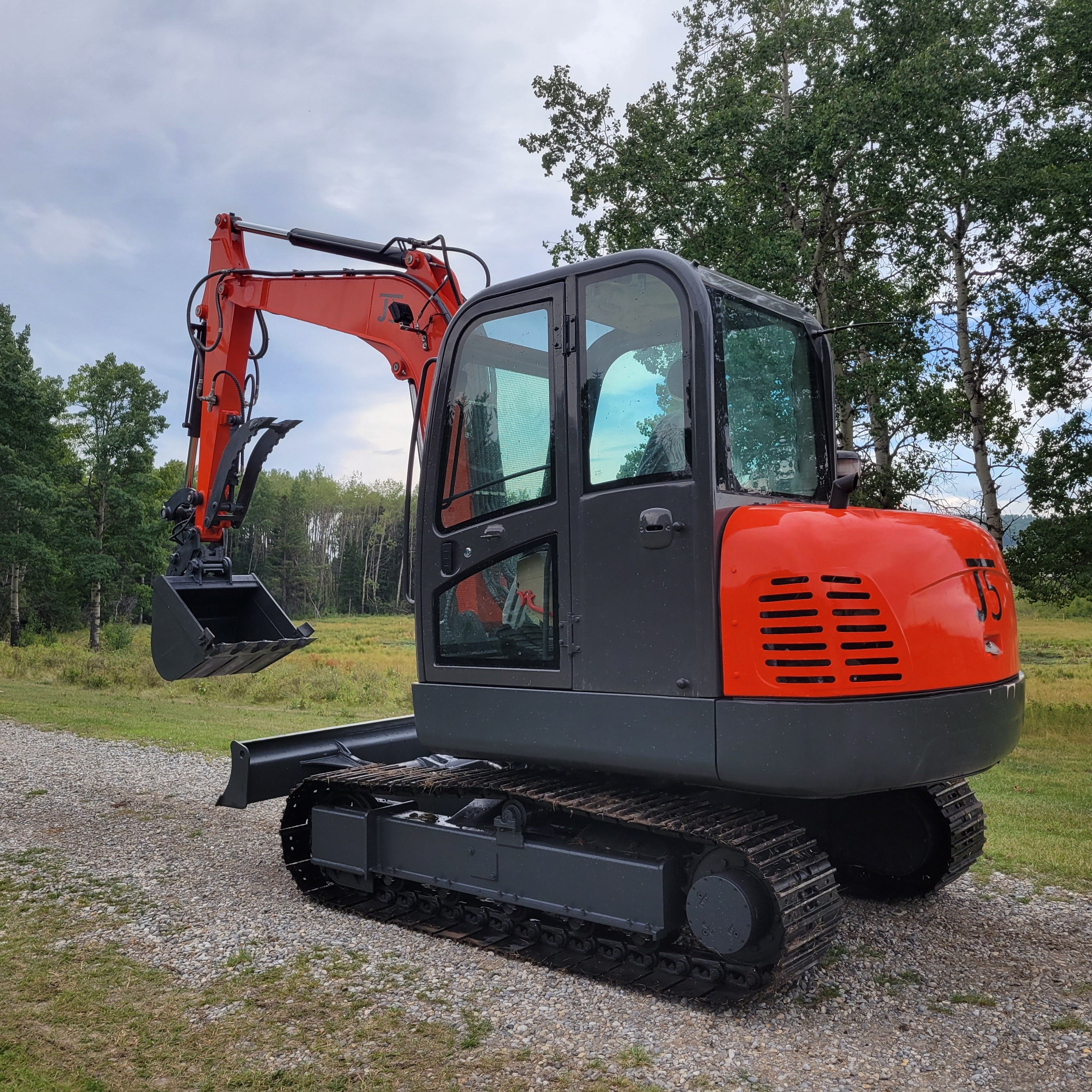 JT5600 6 ton mini excavator for sale in Canada powered by Yanmar engine small construction machine standing on gravel path durable compact excavator for landscaping and building work