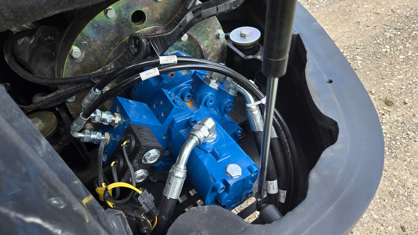 Close up view of JT5600 JoyT5 6 ton mini excavator hydraulic pump, hoses and fittings for smooth digging performance