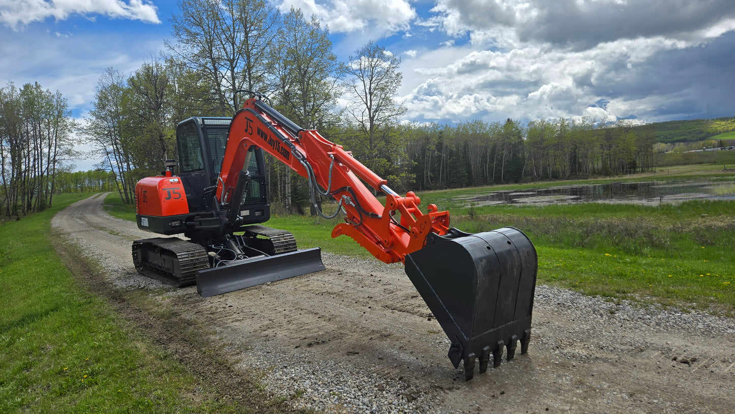 JT5600 6 Ton Mini Excavator for Sale | JoyT5 Yanmar Engine with quick hitch, side swing boom and digging bucket on gravel road