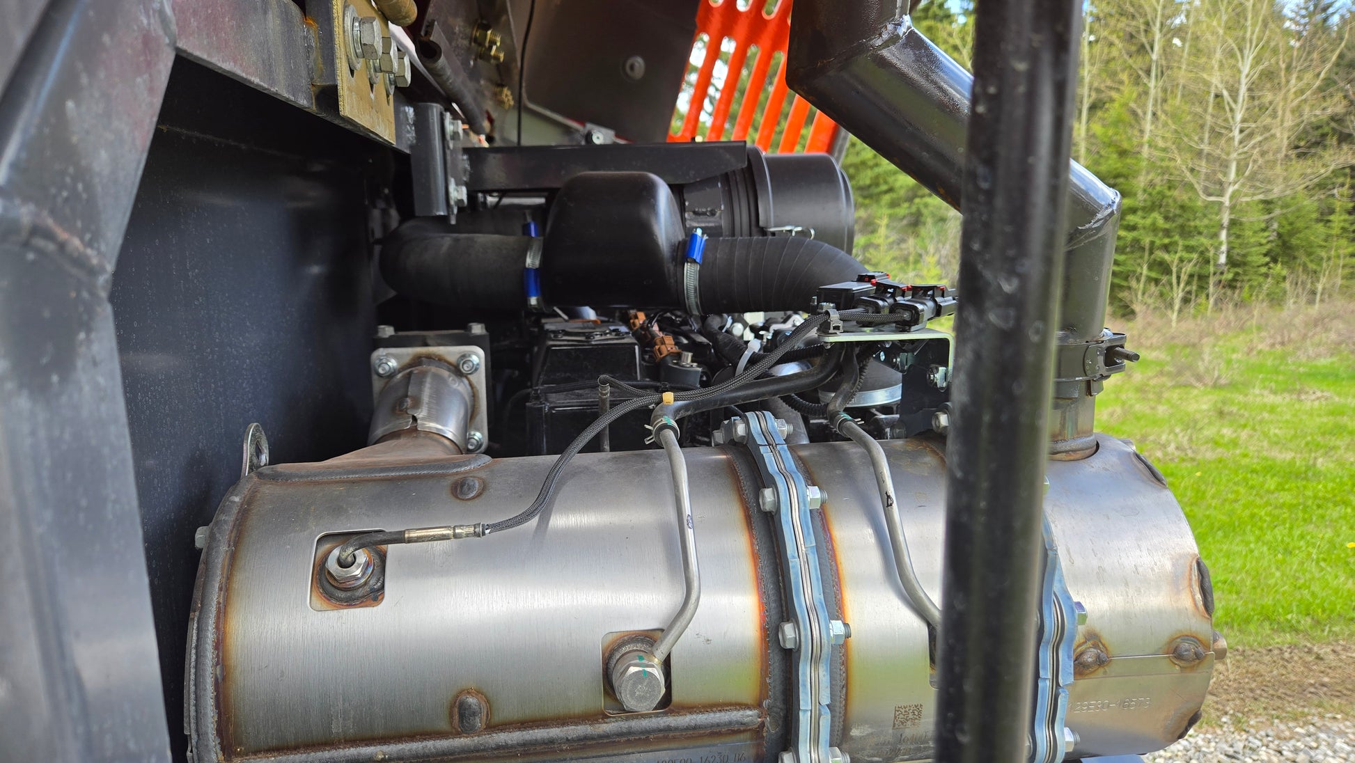 Close up of Yanmar engine and exhaust system inside JT5600 JoyT5 6 ton mini excavator for reliable performance