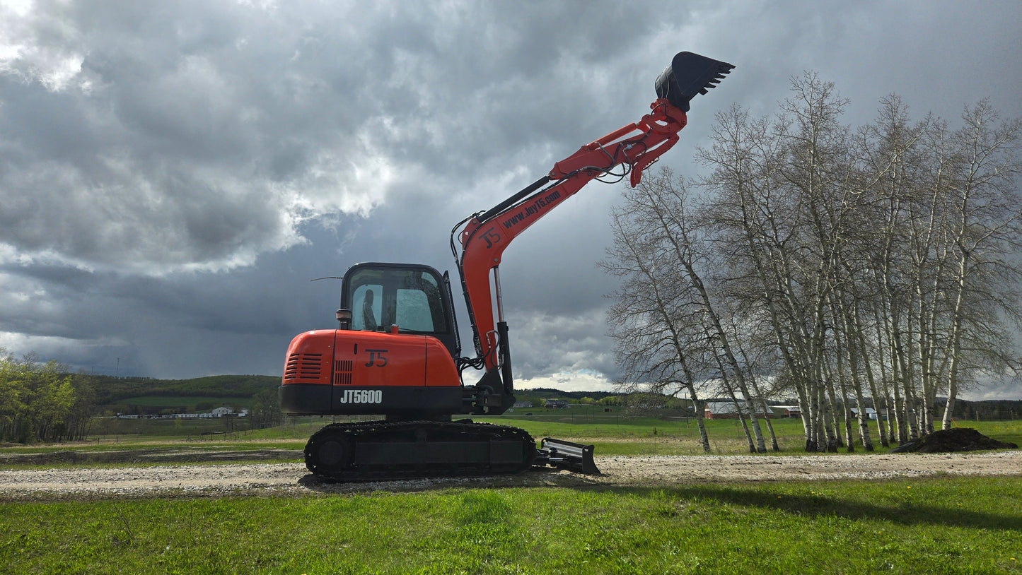 JT5600 JoyT5 6 Ton excavator powered by Yanmar engine side angle view with raised bucket on construction site