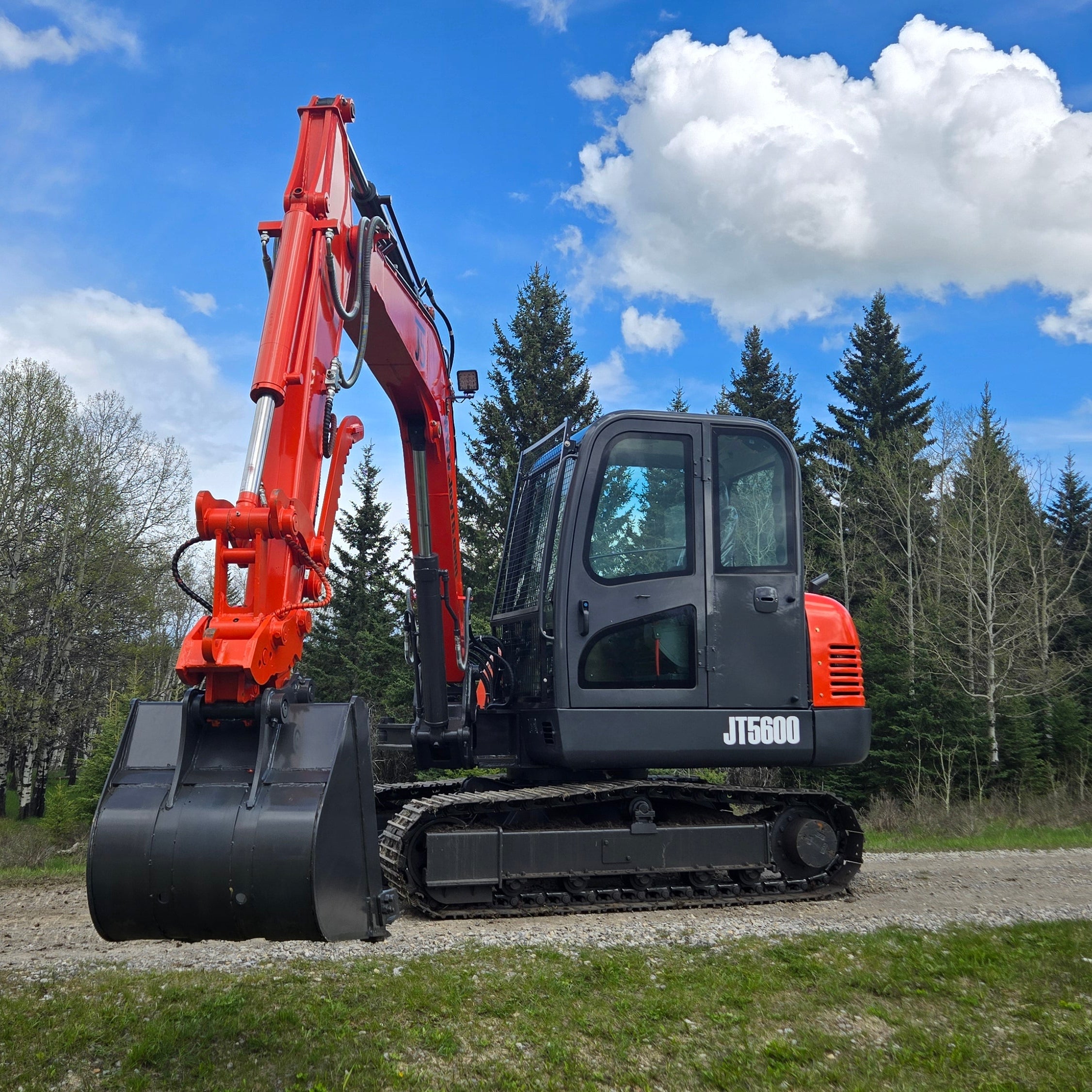 JT5600 mini excavator front angle parked on gravel road in Canada with JoyT5 support for construction and landscaping work