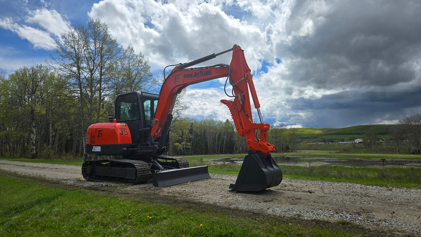 JT5600 JoyT5 mini excavator side angle view with digging bucket and dozer blade