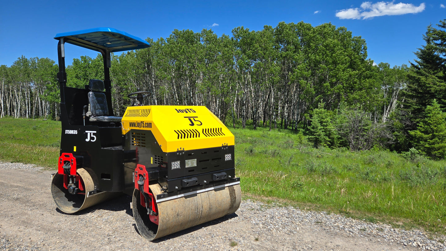 JT5DR35 double drum road roller working on gravel road with green forest background by JoyT5 for sale in Calgary Alberta Canada