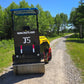 JT5DR35 drum roller compacting a gravel road in Canada heavy duty vibratory drum compactor for road repair and landscaping work
