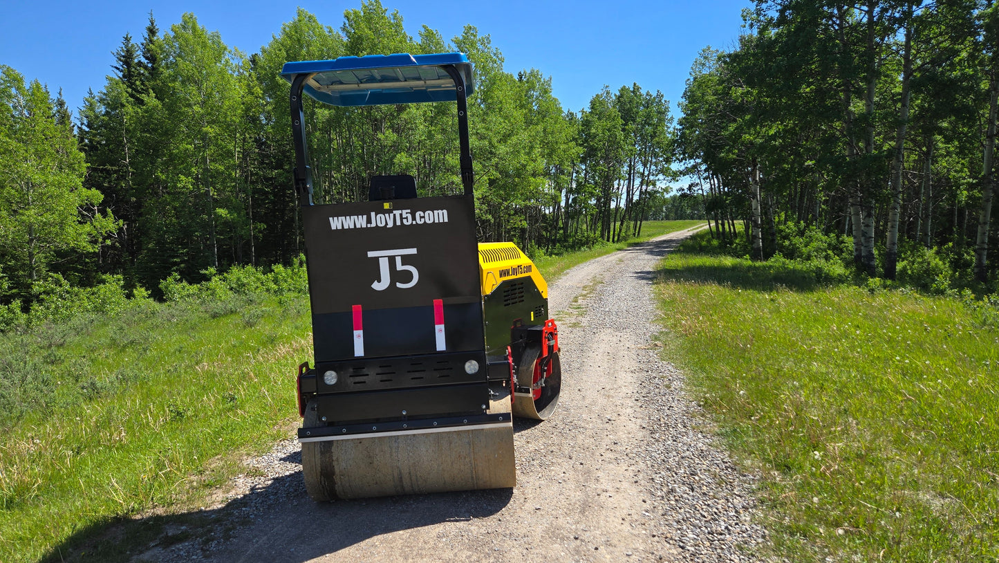 JT5DR35 drum roller compacting a gravel road in Canada heavy duty vibratory drum compactor for road repair and landscaping work