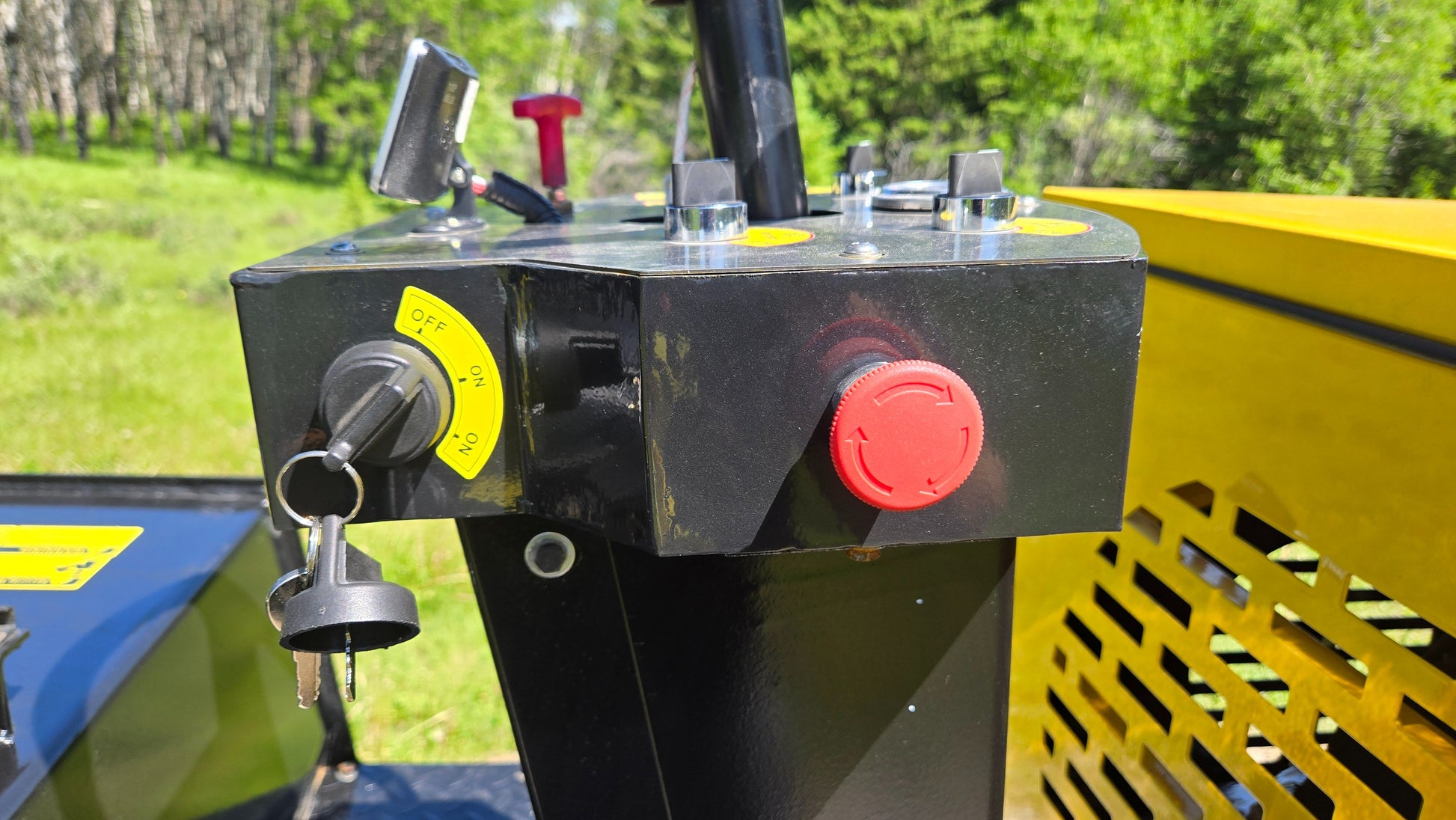 Ignition key and emergency stop switch on JT5DR35 drum roller control panel used for safe operation in road construction and compaction projects in Canada

