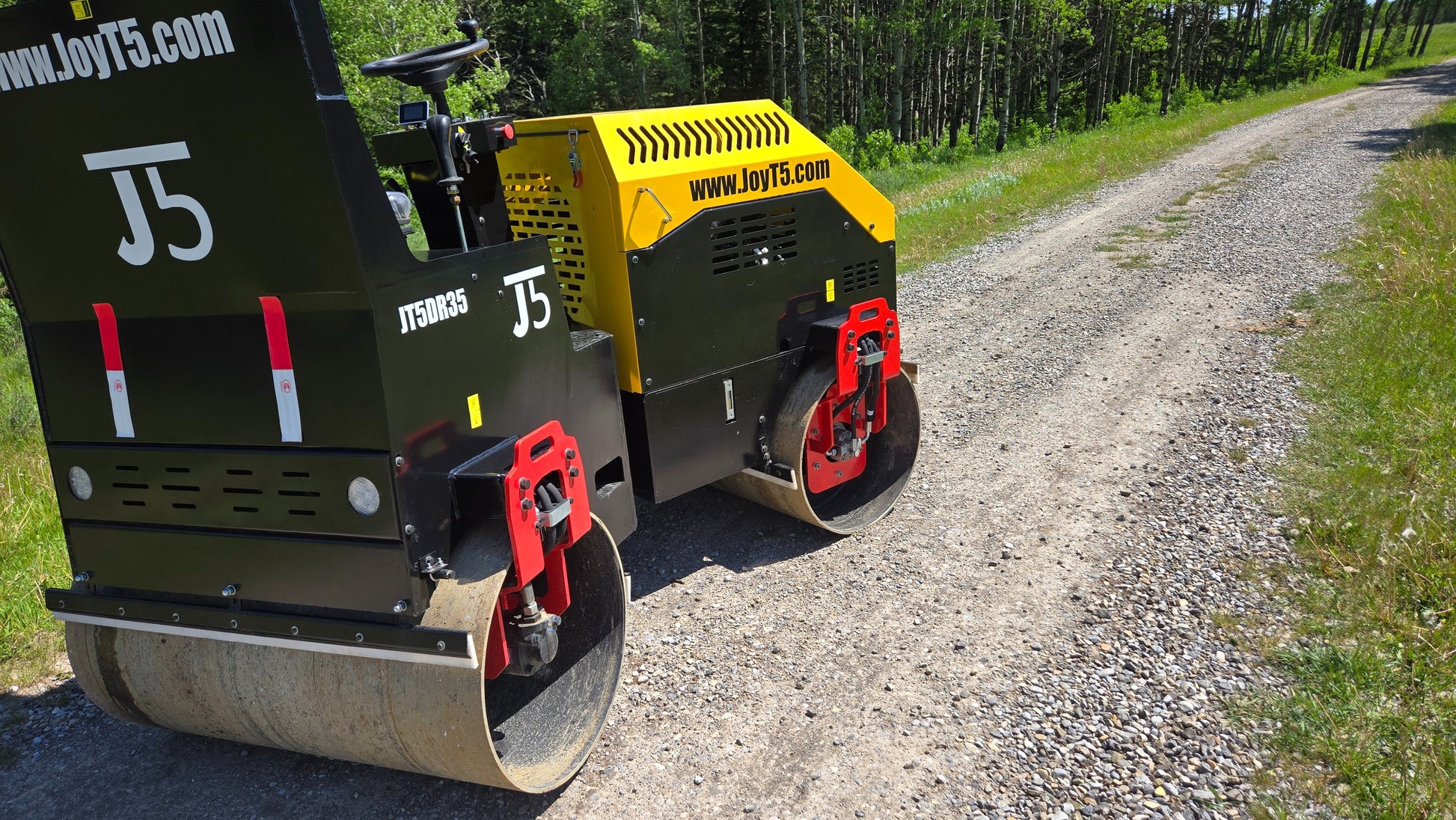 JT5DR35 drum roller working on gravel road showing dual steel drums and compact design for asphalt and soil compaction projects in Canada