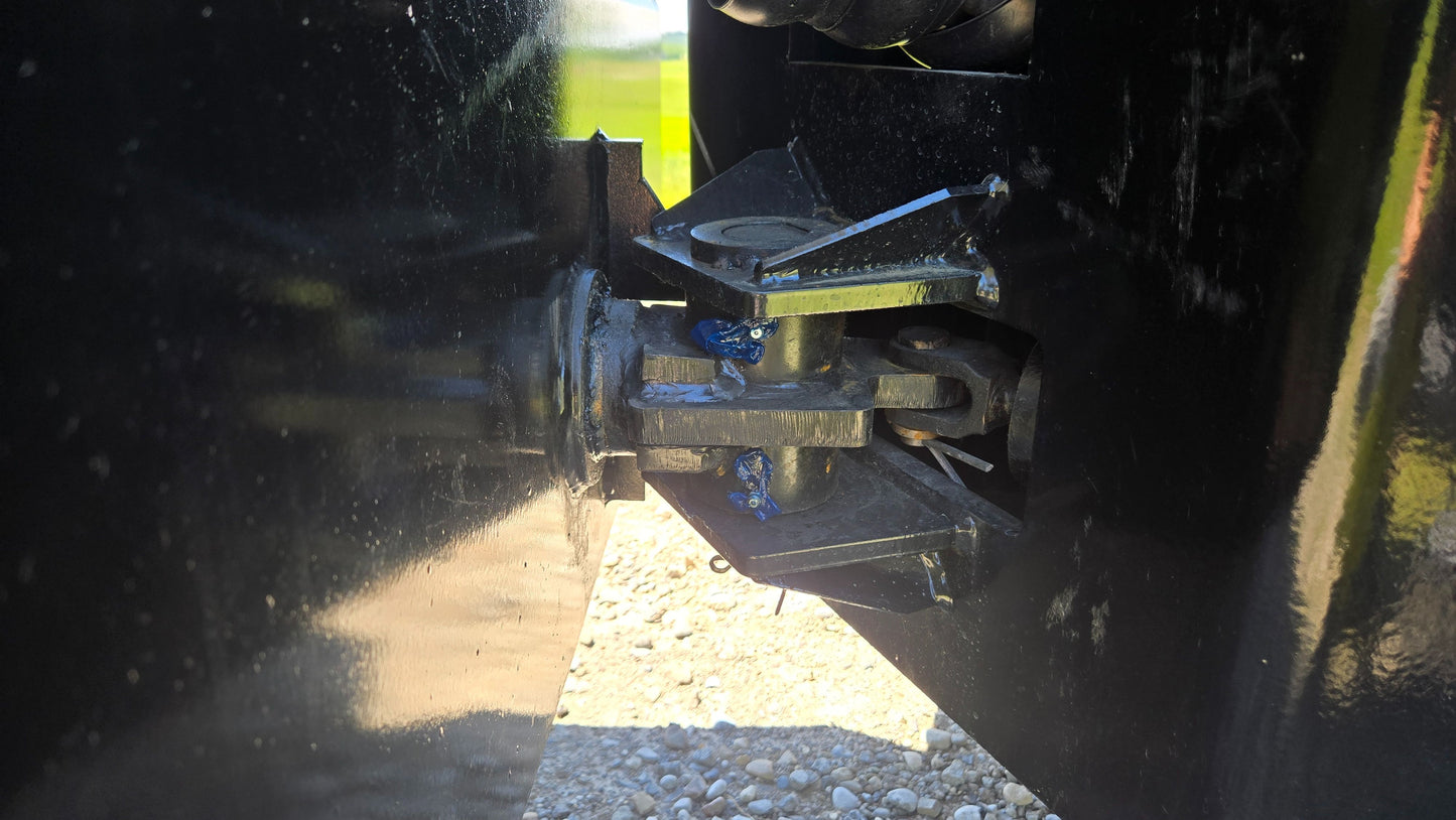 Close up of JT5DR35 drum roller vibratory joint and compaction mechanism on Canadian construction equipment used as a durable soil compactor and road repair roller