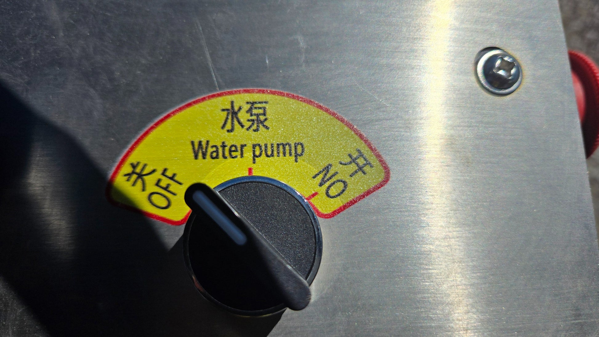 Close up view of JT5DR35 drum roller water pump switch used for controlling water flow in road construction and compaction projects in Canada