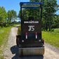 Rear view of JT5DR35 double drum road roller on gravel road with green forest background