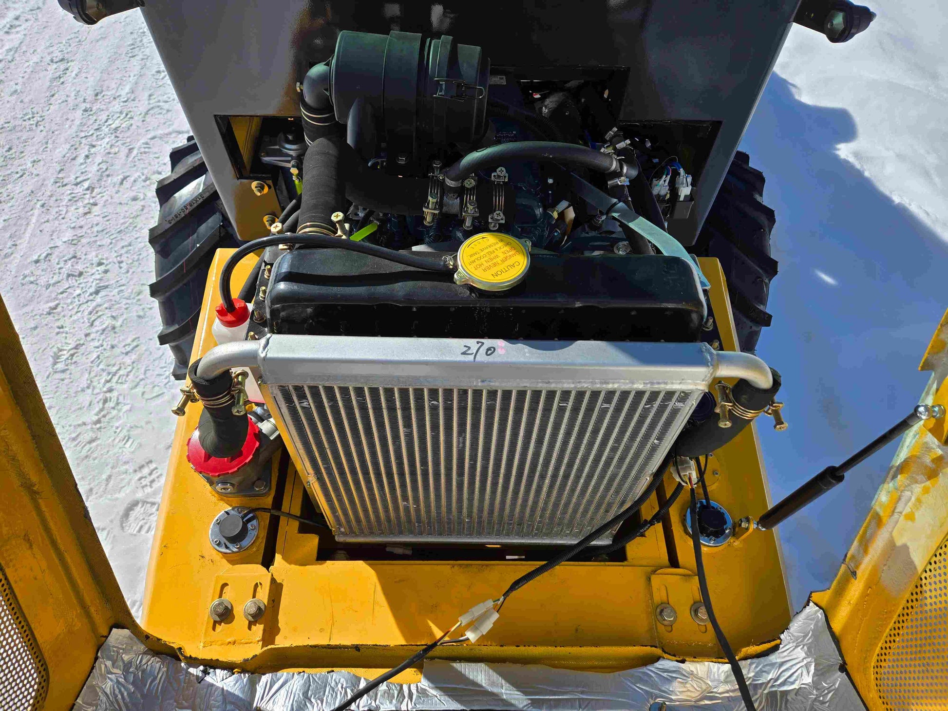 JT5WL1000 compact wheel loader 1 ton 2200 lbs for sale in Canada showing detailed view of engine and radiator system.