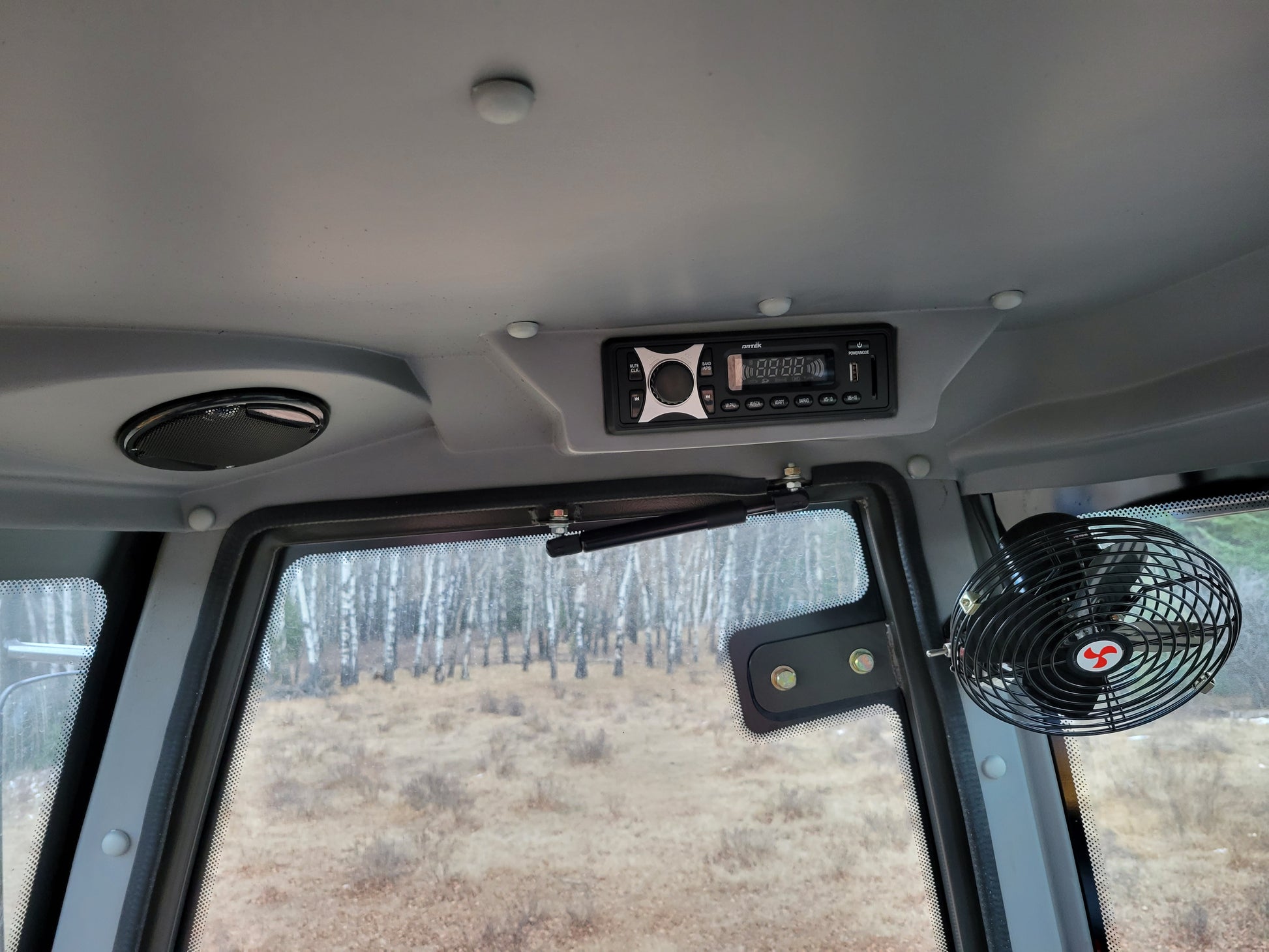 JT5WL1200 compact wheel loader cabin interior ceiling with cooling fan and audio system for operator comfort in Canada

