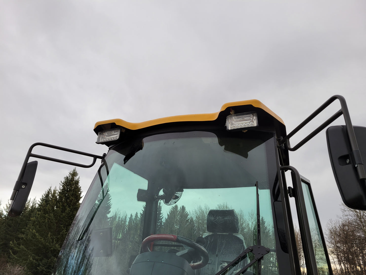 JT5WL1200 compact wheel loader front cabin with LED work lights and wide mirrors for safe operation in Canada