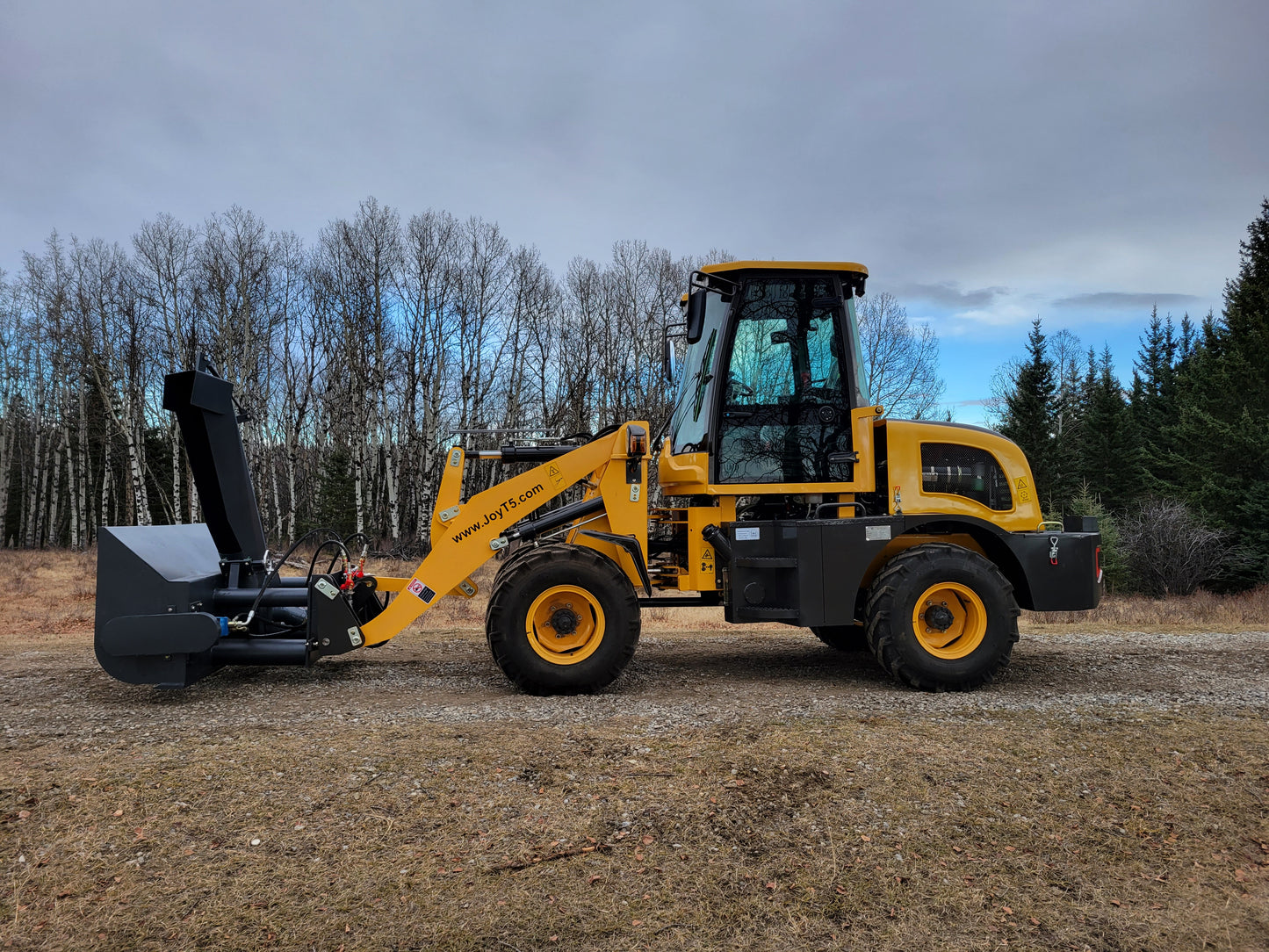 Side view of JT5WL1200 compact mini wheel loader equipped with snow blower attachment, 1.2 ton 2650 lbs loader for snow clearing and versatile outdoor work.