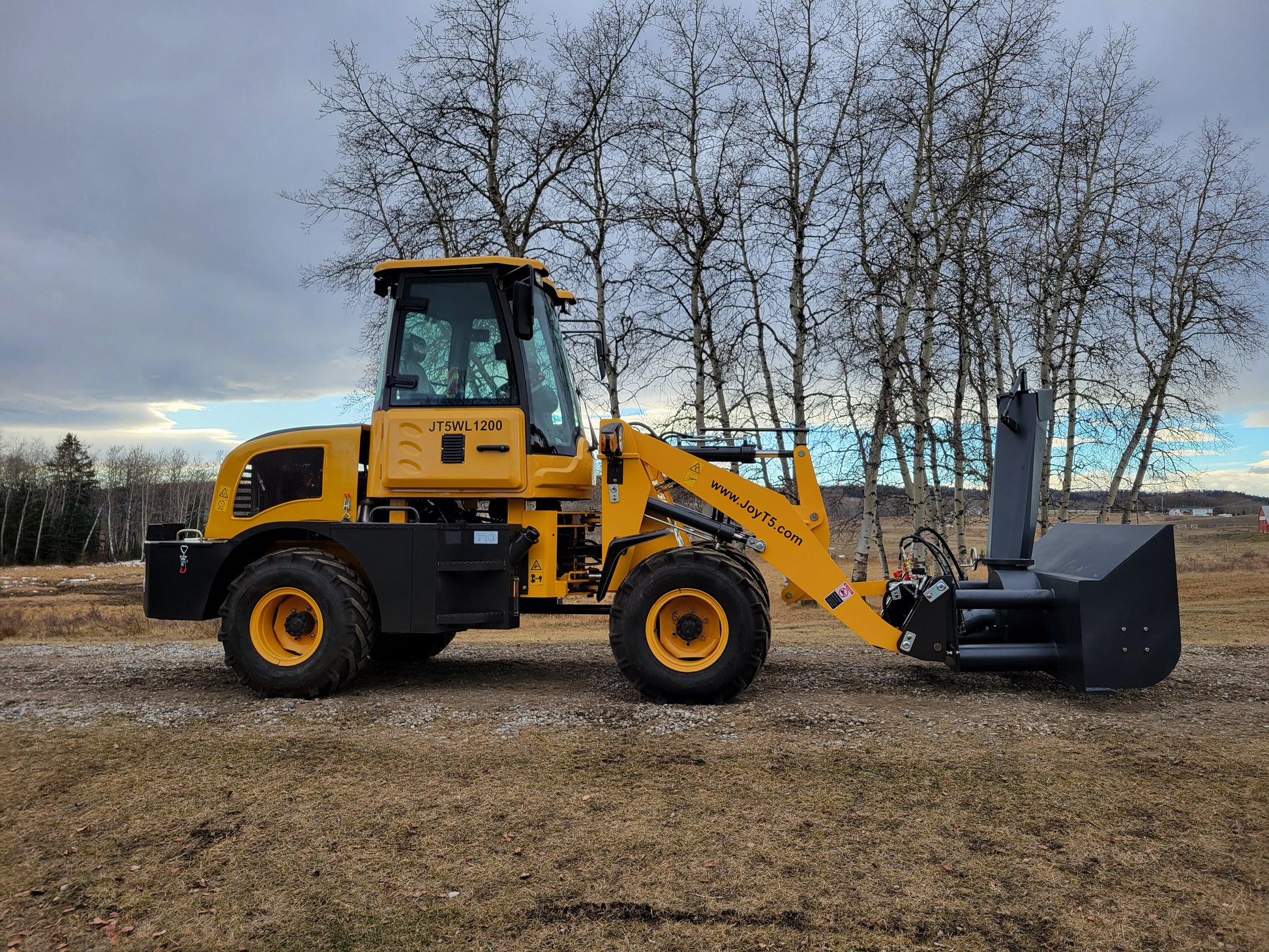 JT5WL1200 compact wheel loader side view with snow blower attachment for efficient snow removal in Canada.