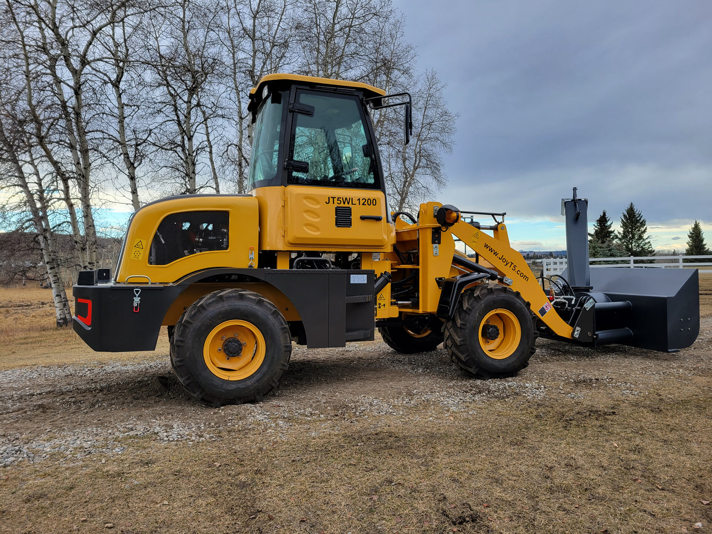 JT5WL1200 yellow wheel loader left side view with snow blower attachment for heavy-duty snow clearing.