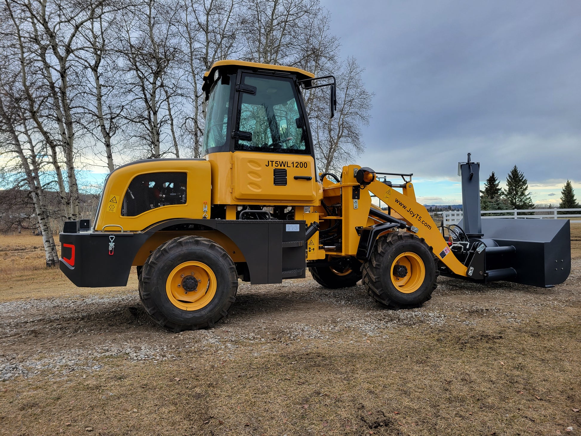JT5WL1200 yellow wheel loader left side view with snow blower attachment for heavy-duty snow clearing.