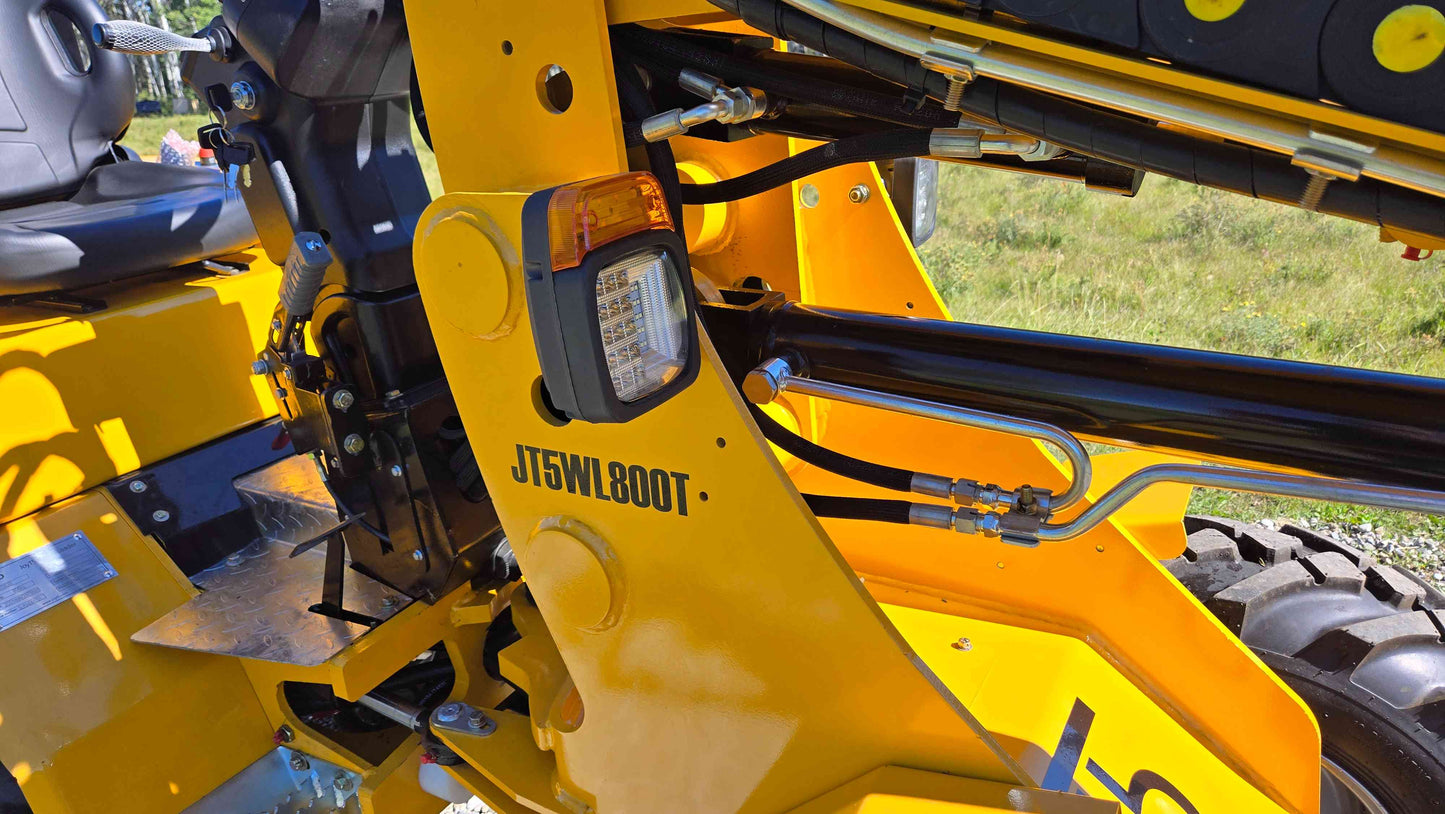 Side frame working light hydraulic hoses and boom cylinder on the JT5WL800 compact wheel loader shown in a detailed view for reliable farm landscaping and construction use across Canada