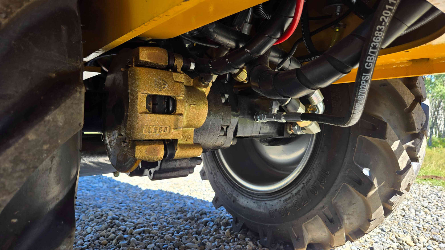 Brake caliper wheel hub and hydraulic line connections under the JT5WL800 compact wheel loader shown in a close mechanical view for dependable farm landscaping and construction work across Canada