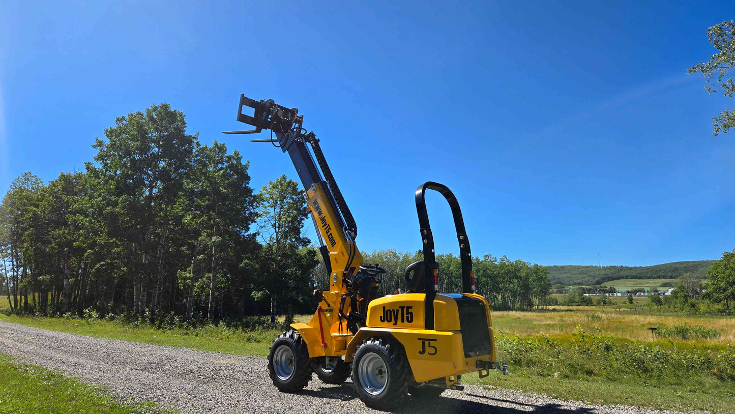 JT5WL800 compact wheel loader lifting with forklift reach attachment for farming construction and landscaping work in Canada


