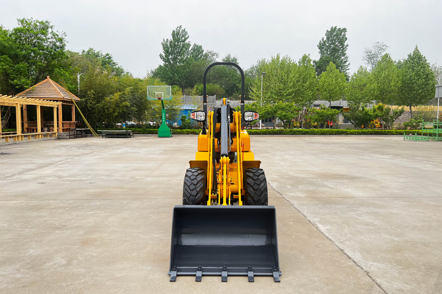 Front view of the JT5WL800 compact wheel loader 800kg 1750 lbs used for landscaping and construction work in Canada