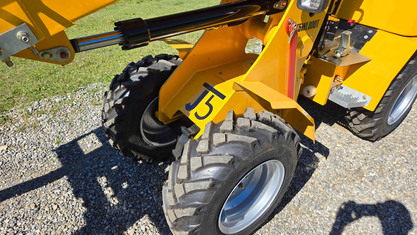 JT5WL800 mini wheel loader front tires and hydraulic system closeup showing rugged off-road wheels and J5 marking