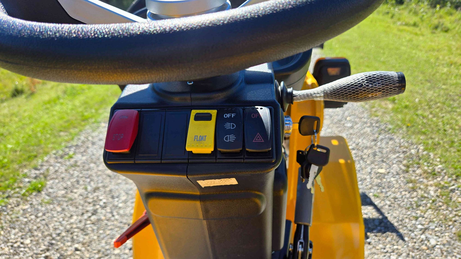 JT5WL800 Wheel Loader for sale Canada with steering wheel control panel, emergency stop button, float switch, and headlight controls for safe operation