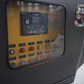 control panel of mini mobile crusher in Canada showing compact tracked crusher operation system for demolition recycling and construction crushing

