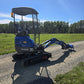 Compact rippa r15 mini excavator for sale side view on gravel road with open field background