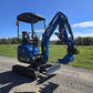Rippa R15 Mini excavator for sale R15  with front blade and lowered boom on gravel road in open field