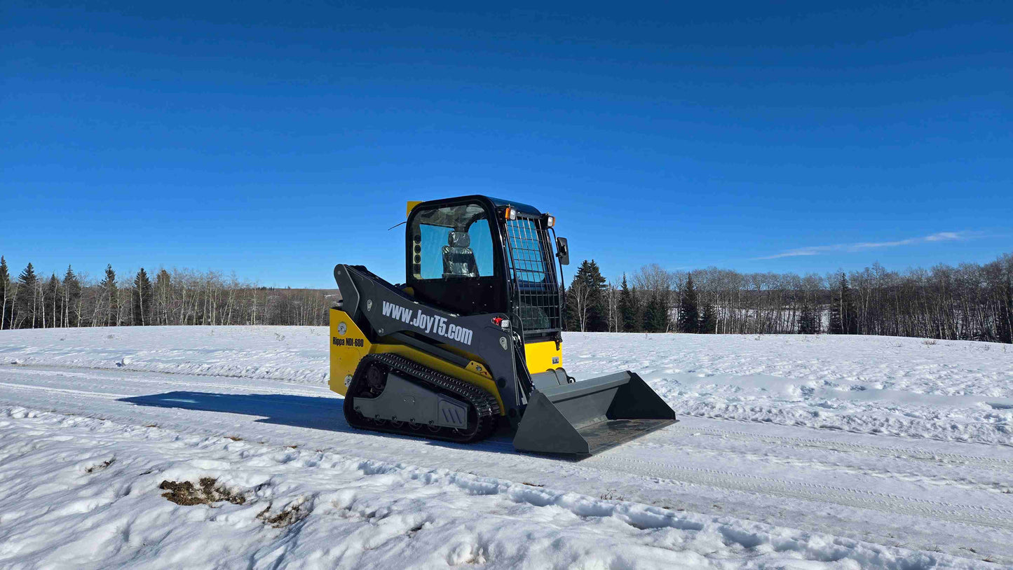 Rippa NDI680 skid steer 74 HP side view operating on snow field for landscaping construction and farming work in Canada by JoyT5