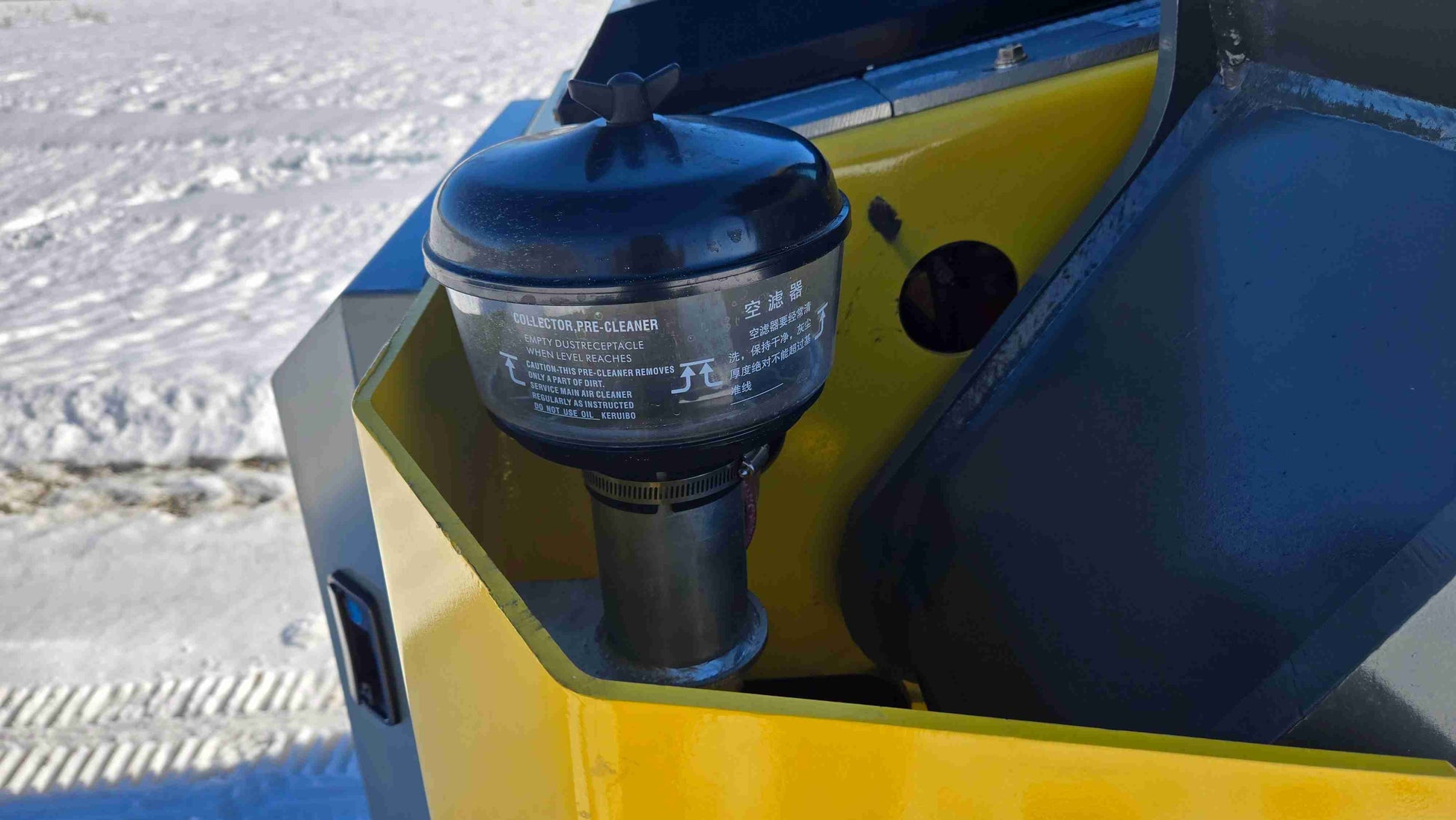 Close-up of the air filter pre-cleaner system on the Rippa NDI680 skid steer loader for dust and debris protection | JoyT5