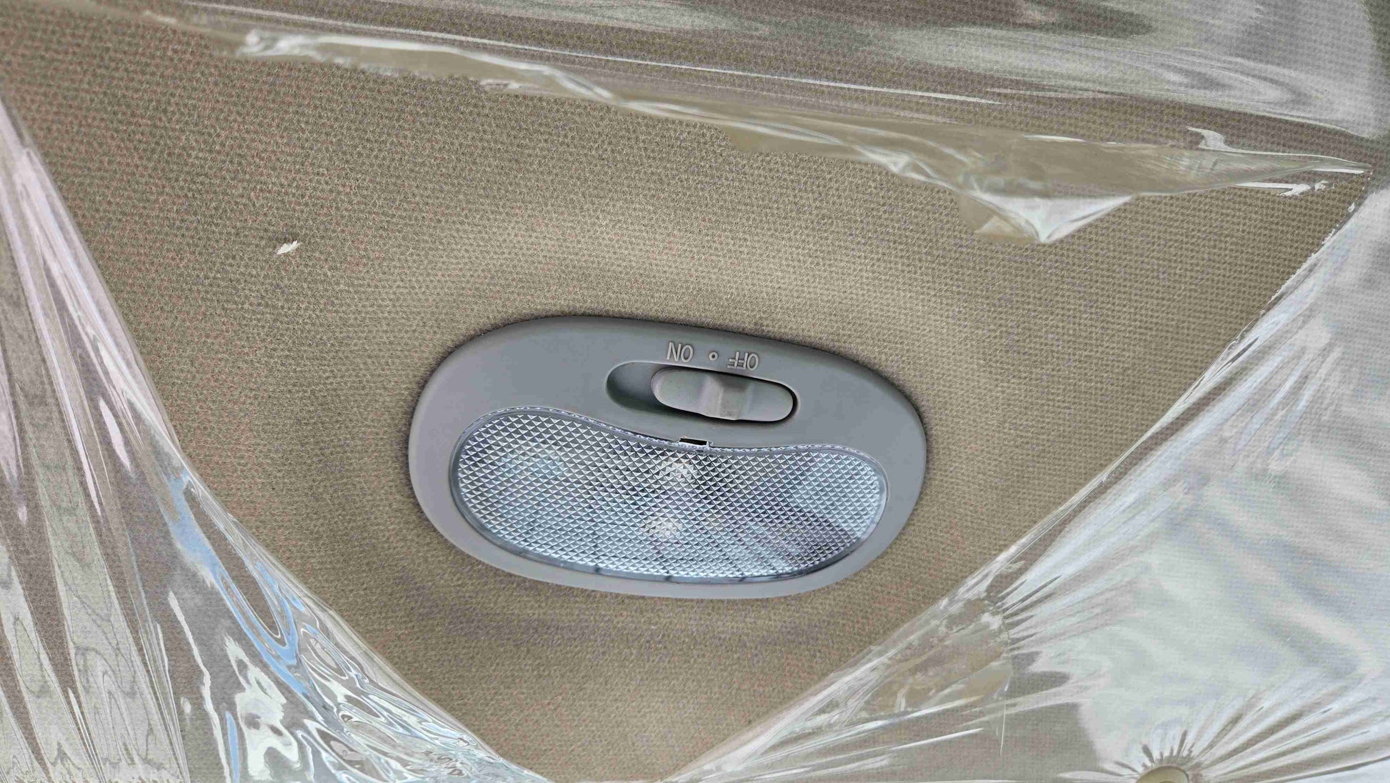 Interior cabin roof light with on off switch inside Rippa NDI680 skid steer providing clear visibility for night work and winter operation in Canada by JoyT5