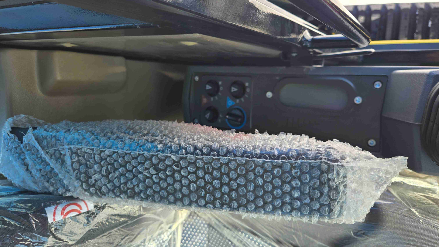 Upper cabin control panel inside Rippa NDI680 skid steer showing interior controls above operator seat for construction landscaping and farming use in Canada by JoyT5