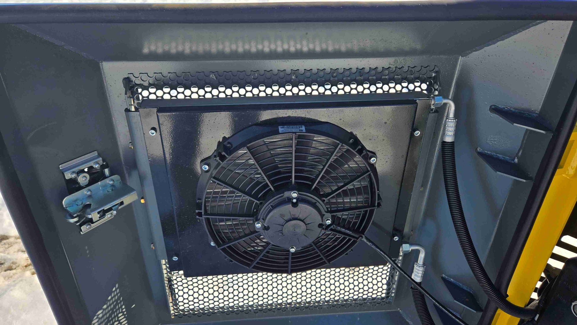 close up cooling fan and radiator system of rippa NDI680 skid steer 74 HP compact tracked loader showing heavy duty performance in Canada

