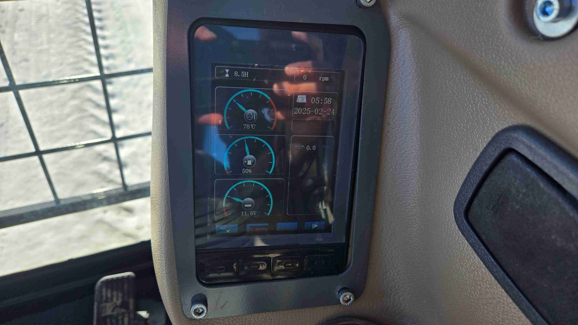 close up digital instrument display screen of rippa NDI680 skid steer 74 HP compact tracked loader showing rpm and temperature controls in Canada