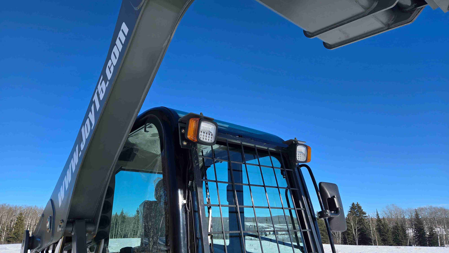 rippa NDI680 skid steer 74 HP compact tracked loader showing cabin with protective grill and hydraulic arm design in Canada

