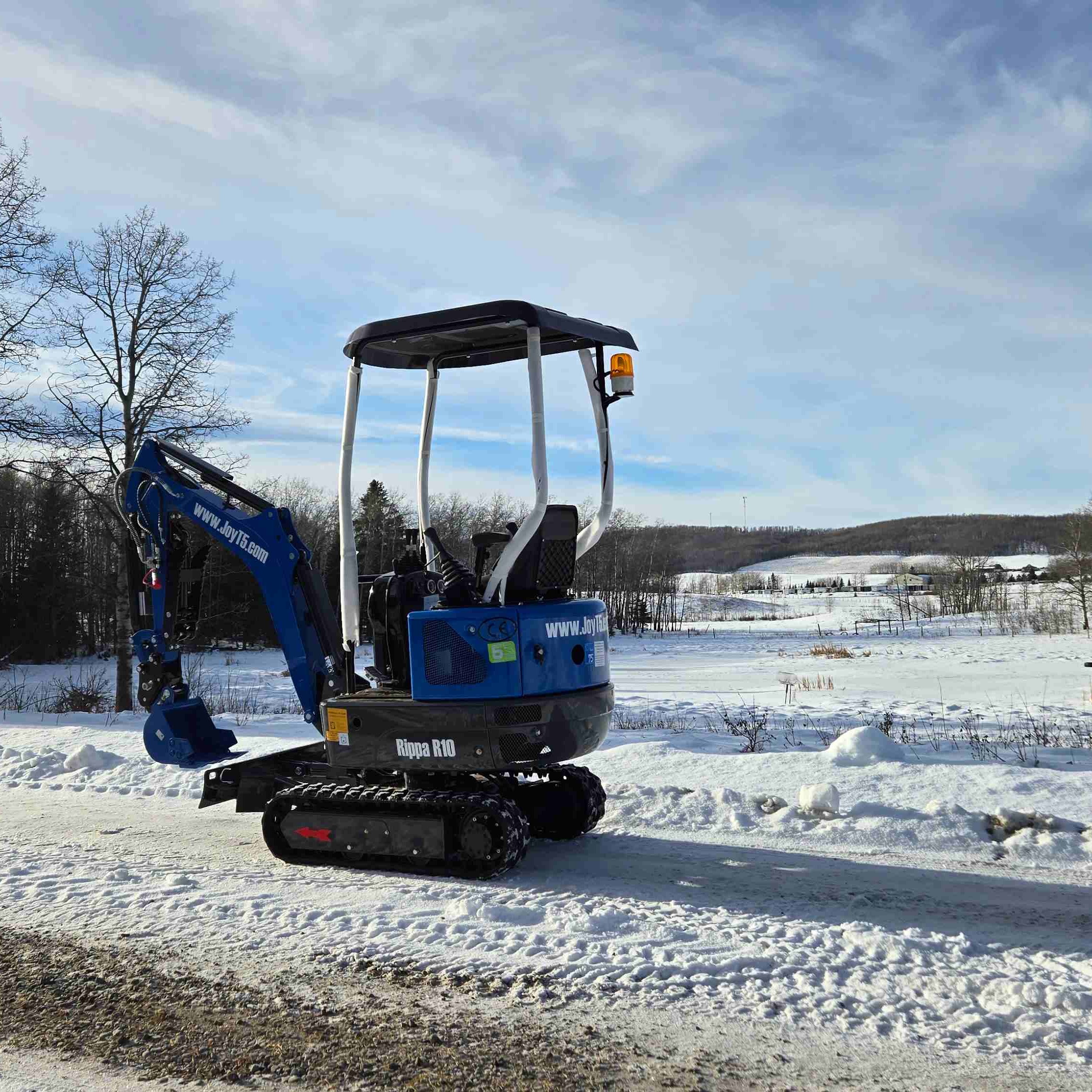 Rippa R10 1 Ton Mini Excavator for Sale in Canada on a snowy work site showing a compact JoyT5 excavator ideal for tight spaces landscaping and small construction projects in Canada
