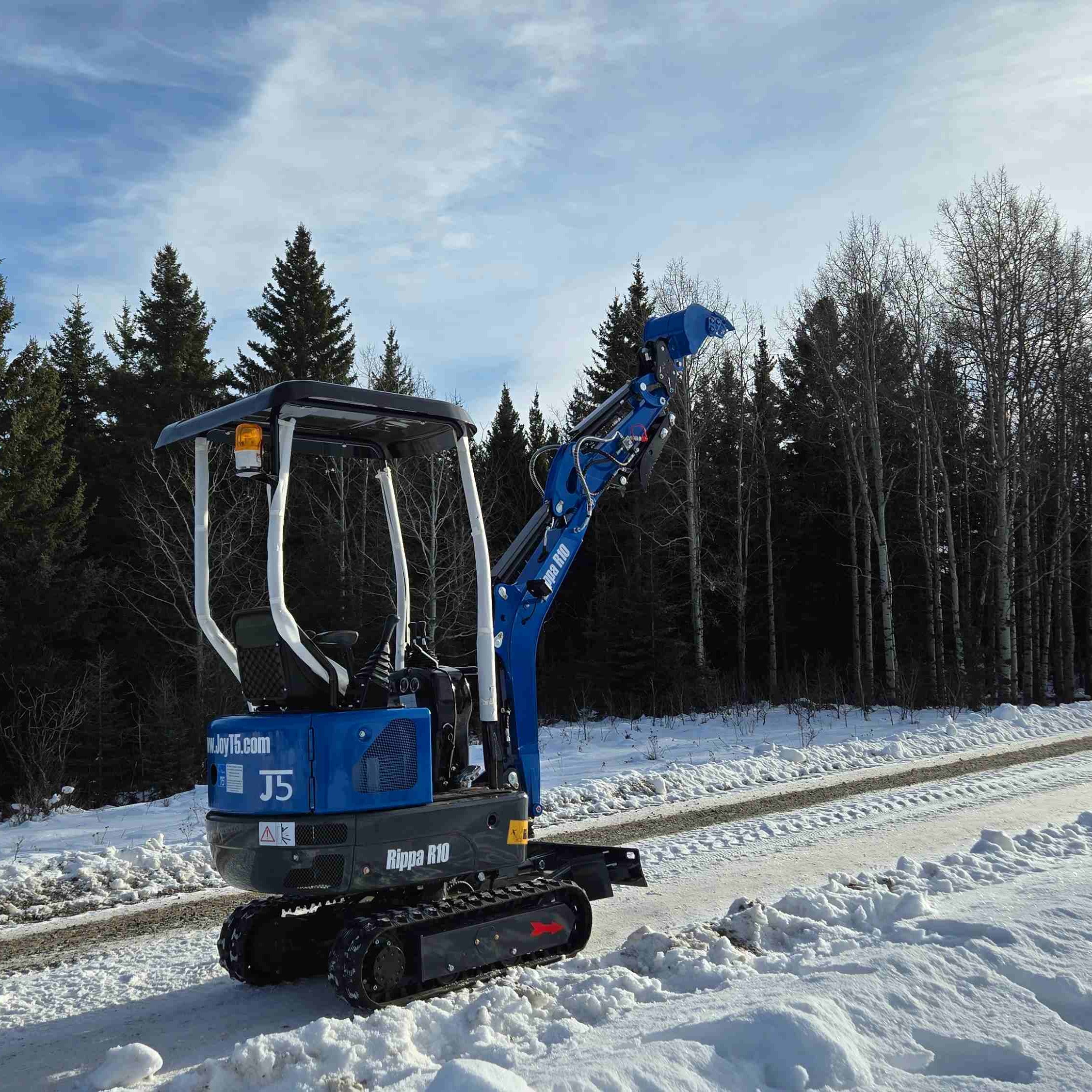 Rippa R10 1 ton mini excavator on a snowy road in Canada with JoyT5 dealer support compact excavator for landscaping and tight spaces